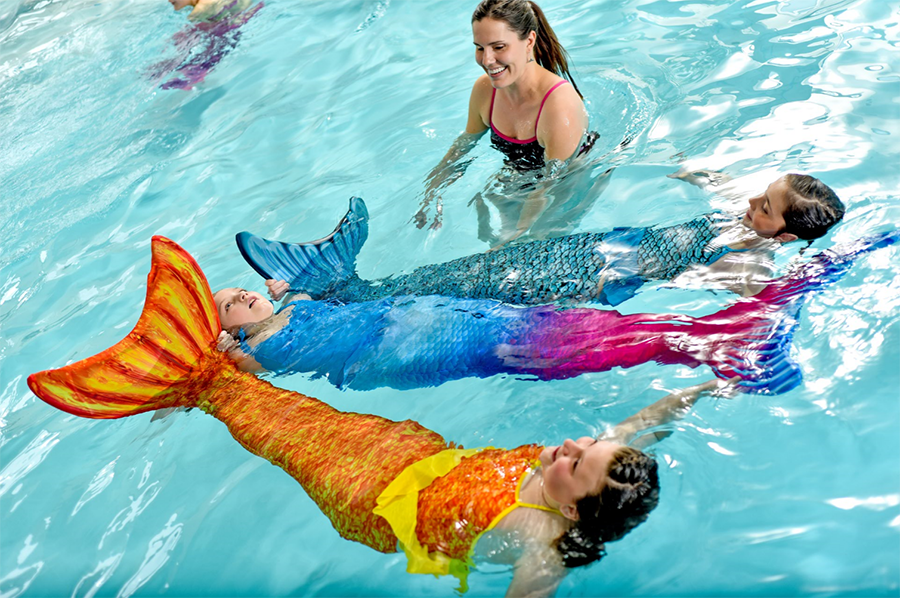 girls learning swimming skills in their Fin Fun mermaid tails