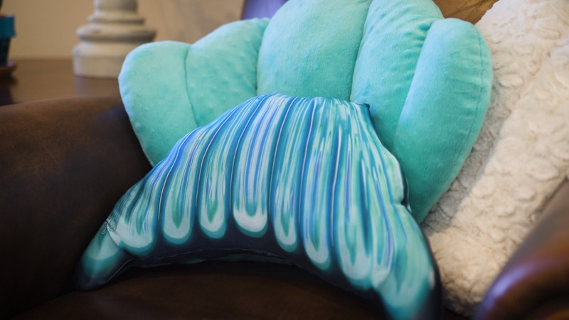 upcycle your mermaid tail fluke as a pillow and put in on the couch with your other mermaid-themed decor
