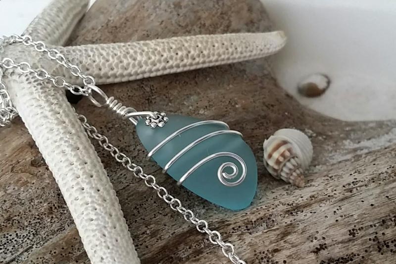 sea glass necklace around a starfish 