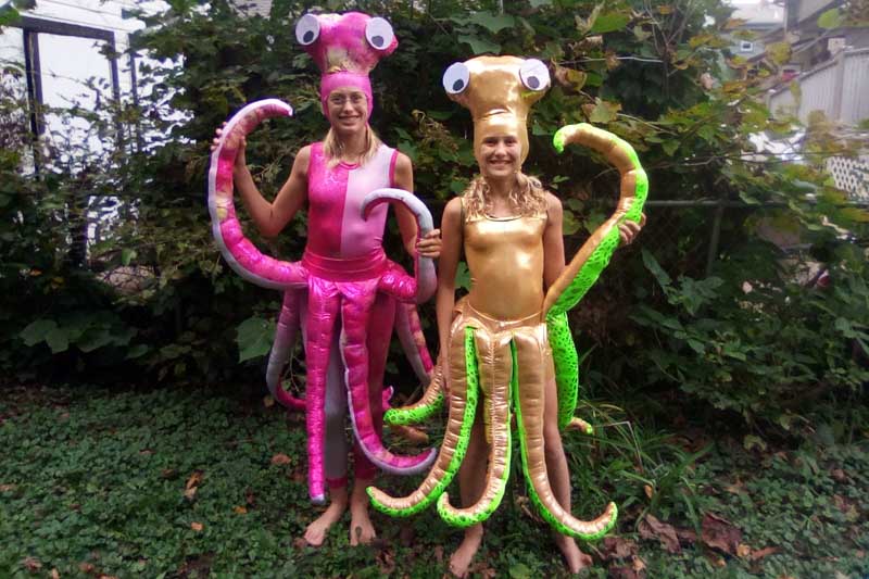 two people dressed up as squids for the creatures of the sea costume contest