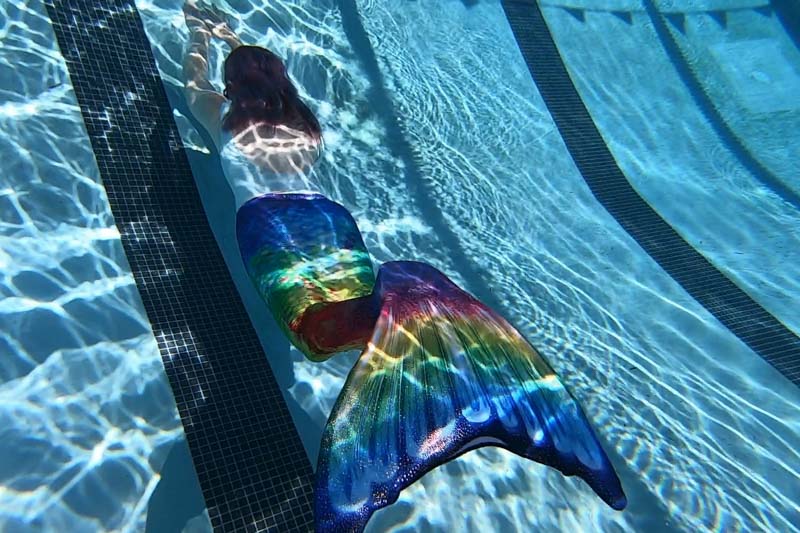 Molly swimming in a Fin Fun mermaid tail at a Mermaid U class.