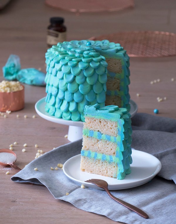 blue and green cake with frosting scales