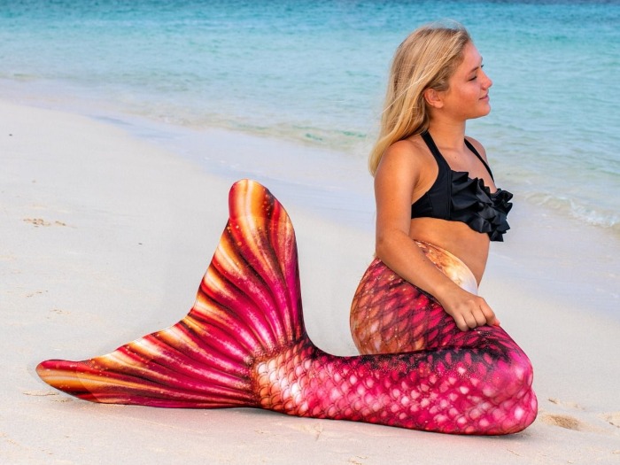 girl in the Bronzed Ruby mermaid tail on the beach