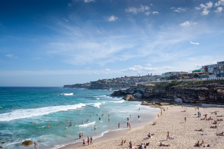 People visiting the beach on a sunny day