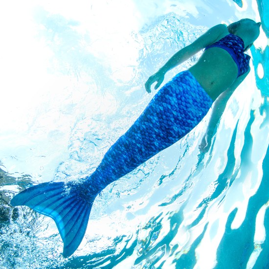 girl swimming underwater in the Arctic Blue Mermaidens tail