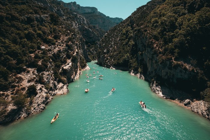 people boating down a river