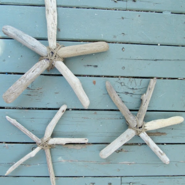 rustic driftwood starfish hang on teal-painted wood