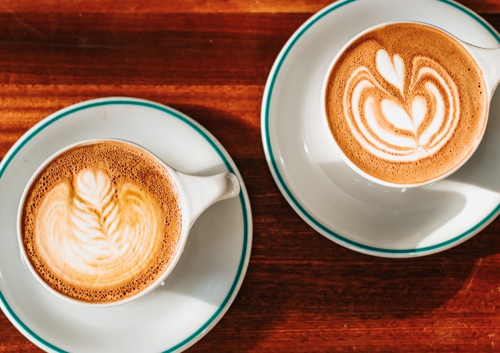 two cups of coffee in reusable mugs