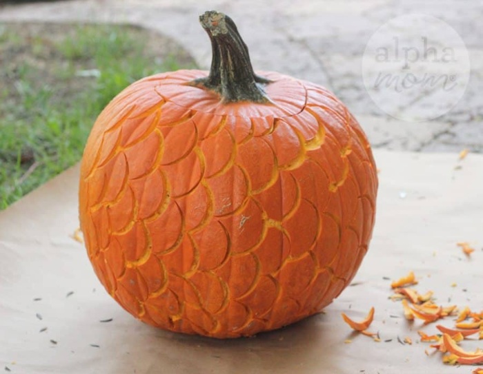 celebrate a mermaid halloween by carving overlapping scales into a pumpkin like this one